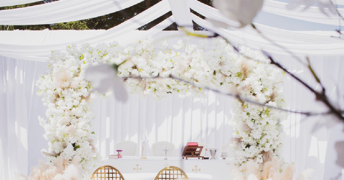 Winter Wedding With White Drapes Adorning The Ceiling