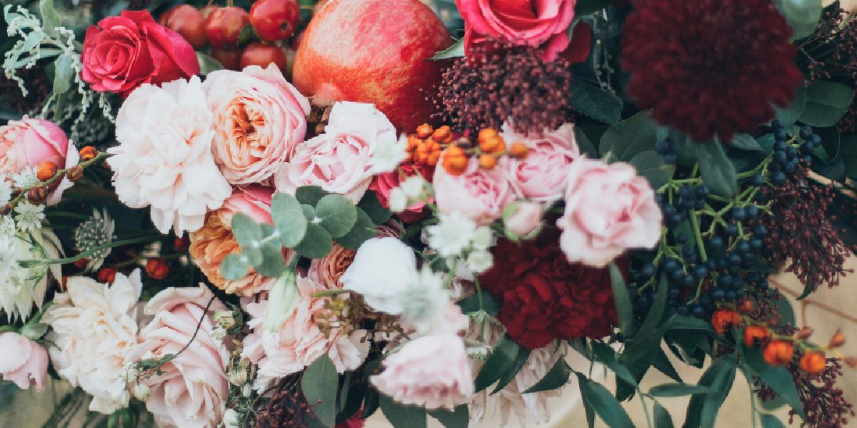 Lush bouquet of red, pink, and white artificial flowers