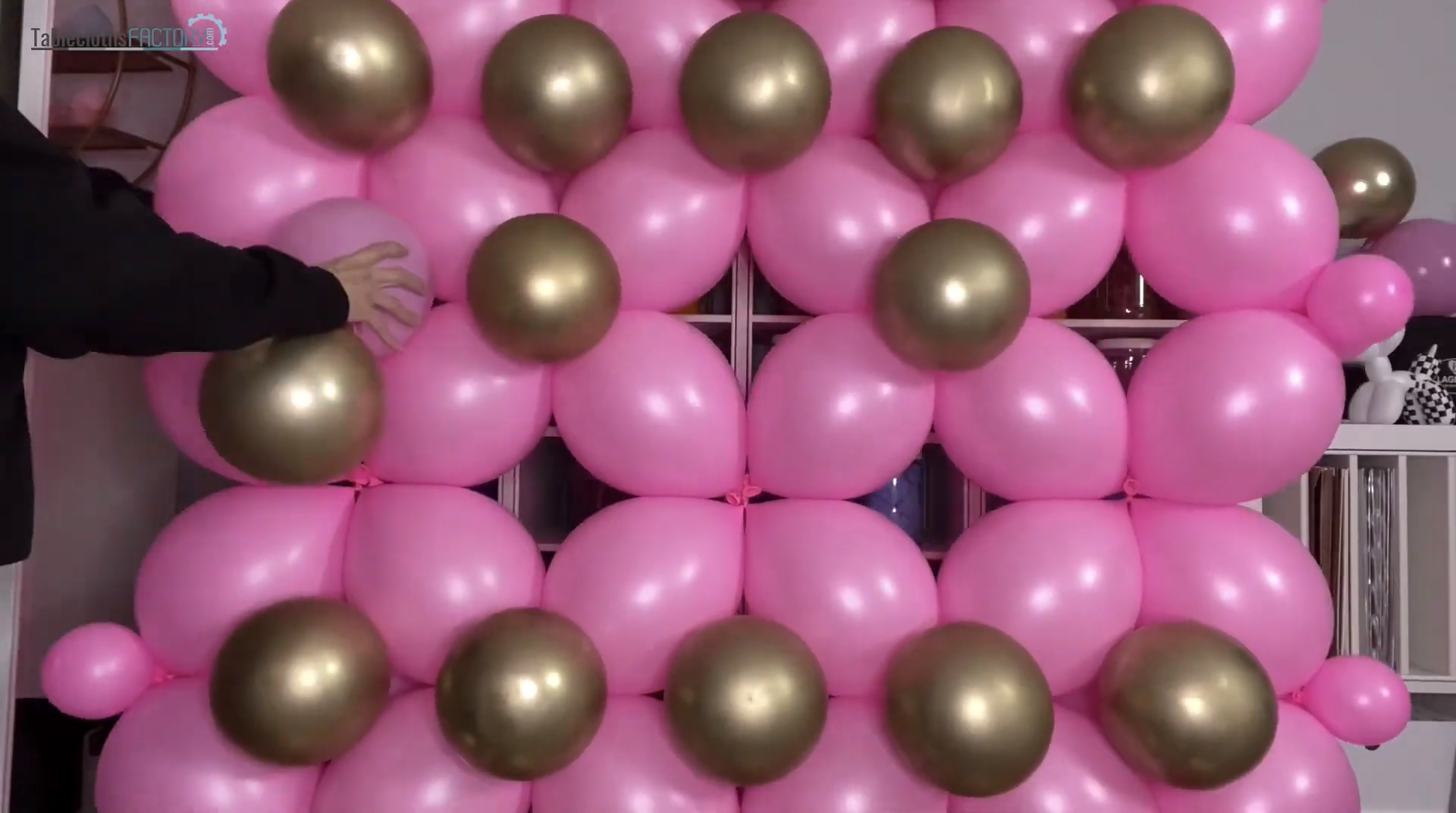 Assembling the pink and gold balloon wall decor