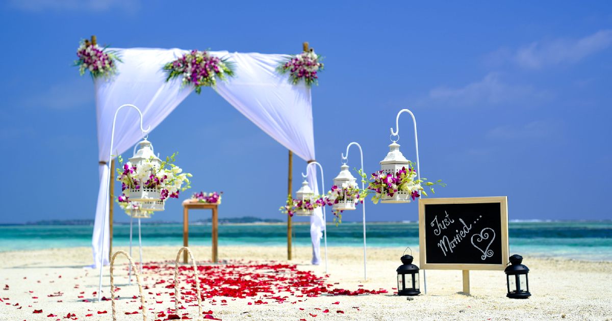 Creating a photo booth is a wonderful idea for a beach wedding reception