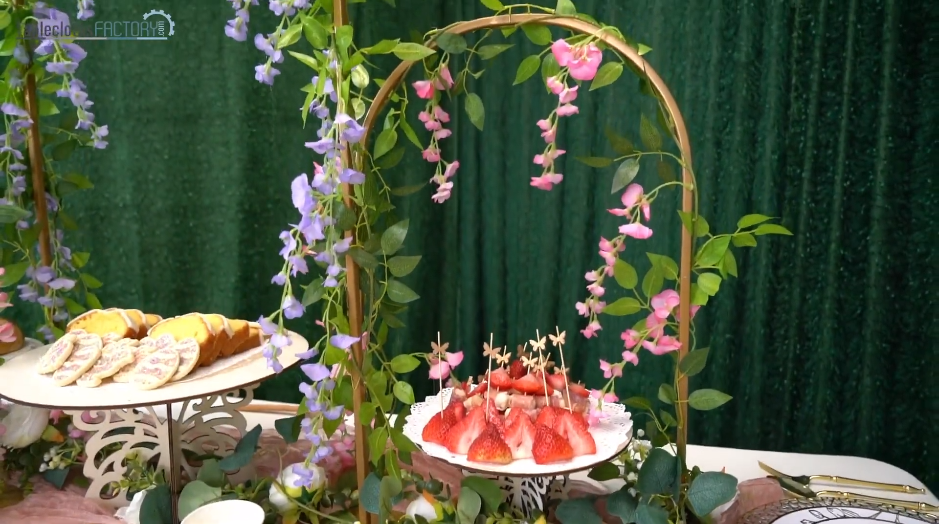 Spring party decor with elegant cake stands adorned with flowers.