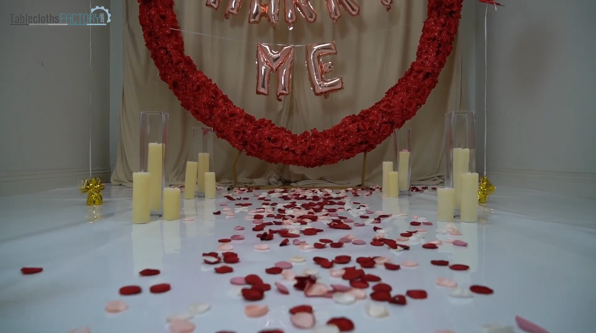 LED candles in glass vases with petals and aisle runner