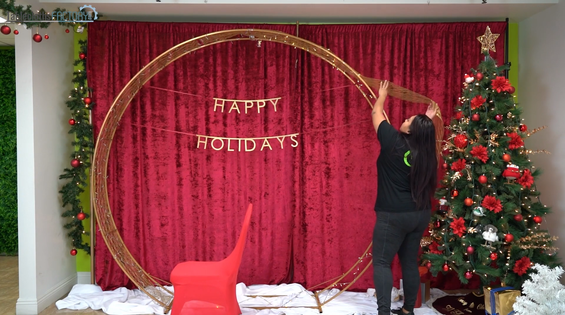 Adding lights and woven fabric ornaments to the backdrop stand