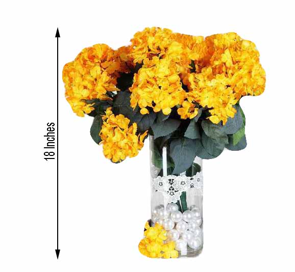 yellow artificial flowers in vase