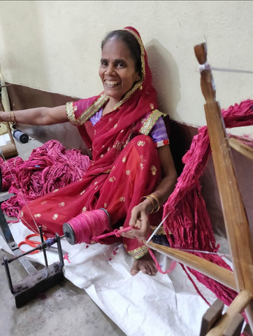 woman collecting recycled sari yarn