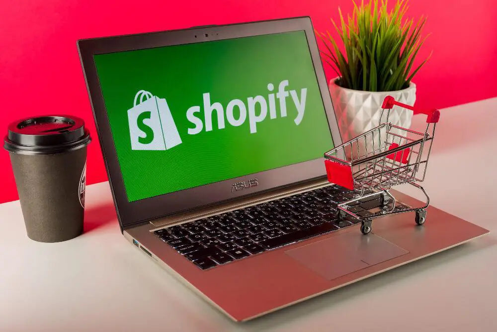shopify logo displayed on a laptop