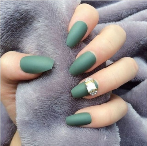 A diamond accent nail adds some extra glam to a matte manicure