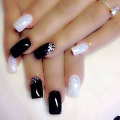 Alternating black and white nail design