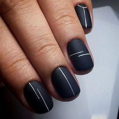 White line nail design on black background