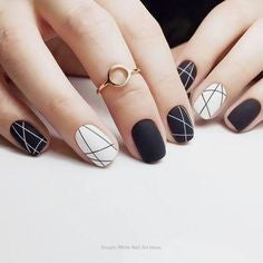 Black and white staggered nail design