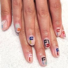 Glitter pink rhinestone letter nail design