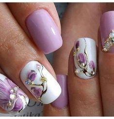 Purple flowers with rhinestone nail design