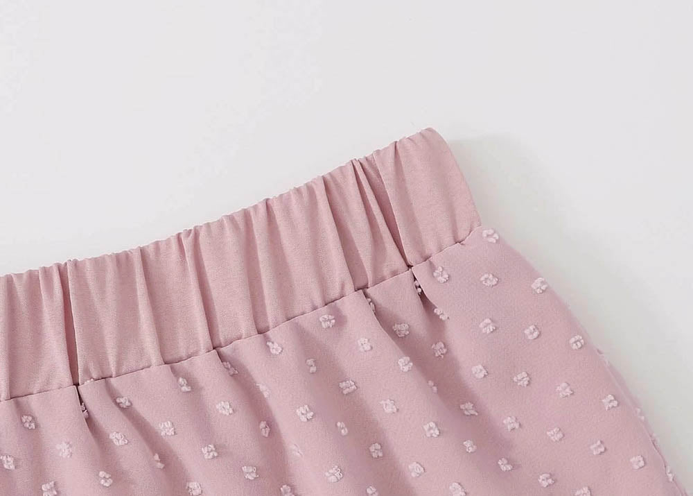 Elastic waist of a  pink swiss dot skirt