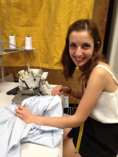 A very young and smiling Giulia at work on one of the shirts from Marta Scarampi's collection