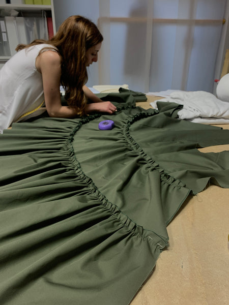 Giulia checking the exact stitching on one of the dresses from the Marta Scarampi collection