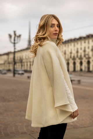 A woman in Piazza Vittorio Veneto in one of Marta Scarampi's most beautiful capes