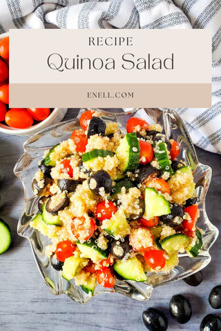 Healthy quinoa salad recipe in a bowl with red cherries, black olives, and sliced cucumber