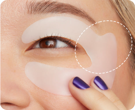 Retinol Eye Lift Patch on a face with a circle around the winged tip of the patch