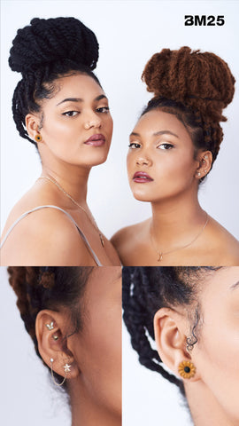 Two young women wear an earscape curation of body jewelry from bm25.com