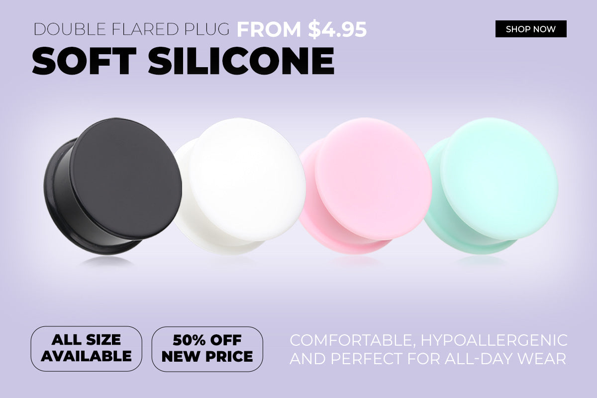 Four Silicone body jewelry Gauge Plugs for stretched ears in black, white, pink, and mint green all from bm25.com
