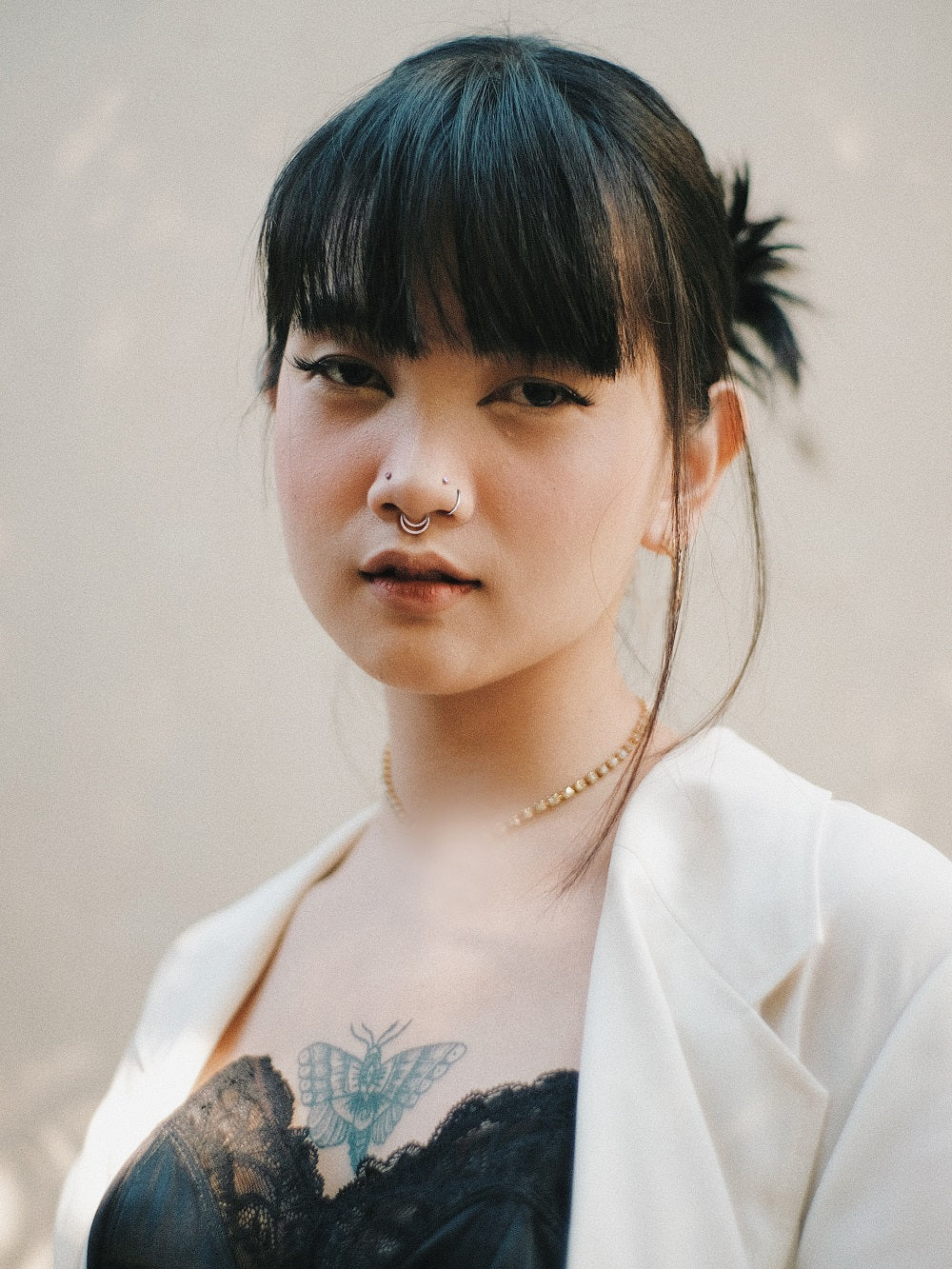 Young woman wears facial body jewelry and body piercing jewelry from bm25.com