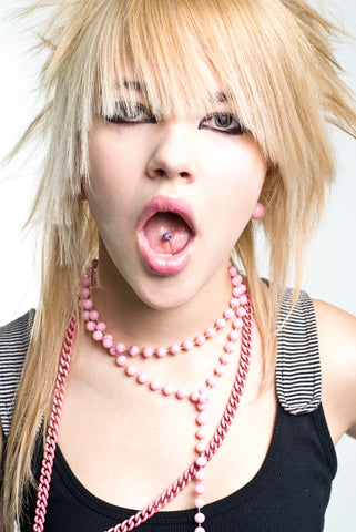 Young Blonde Woman wears risky tongue piercing with bm25.com piercing jewelry