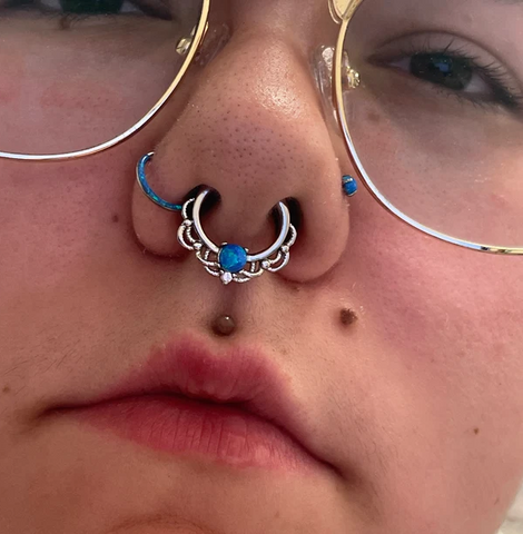 Facial piercing inspiration featuring BM25's Fire Opal Turan Septum Clicker ring and Fire opal basic clicker and stud.