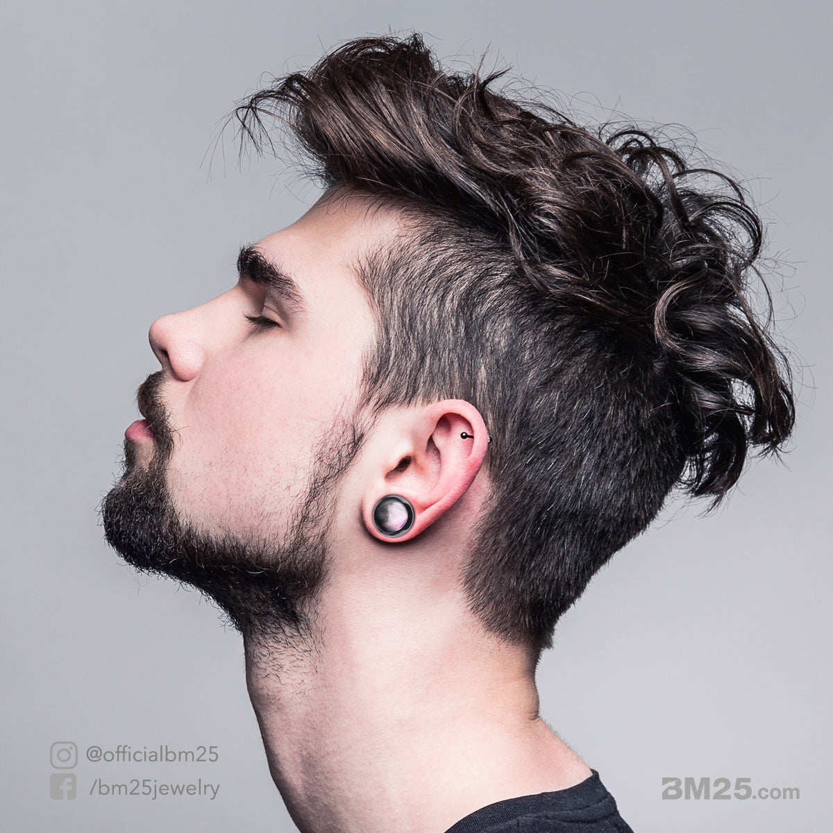 Young man wears Ear Stretching Body Jewelry plugs from bm25.com