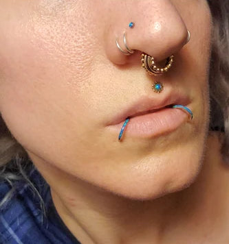 Facial piercing inspiration featuring BM25's Blue fire opal rings and studs