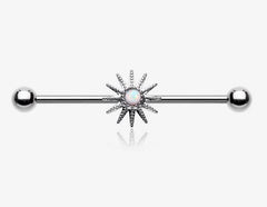 Fire Opal Sunburst Sparkle Industrial Barbell with sunburst charm and sparkly opal center. 
