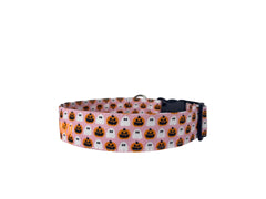 A pink halloween collar with orange jack o lanterns and white ghosts.