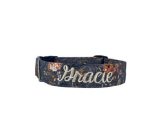 A charcoal gray dog collar with floral designs.