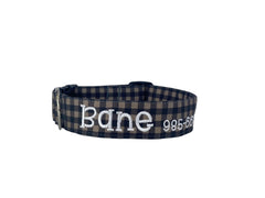 A gray and black flannel dog collar.