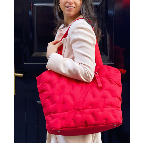 Bold red tote styled with a soft, feminine pale pink Club Monaco Jacket 