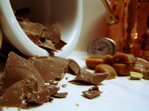 bulk chocolate chunks coming out of double boiler with thermometer in the background