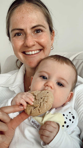 breastfeeding mum eating her lactation cookie