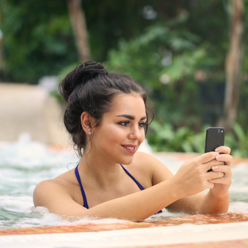 woman in swimming pool on phone