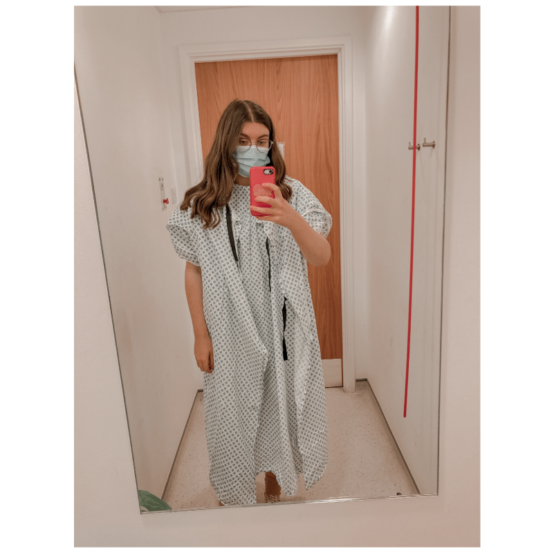 abbie wearing a hospital gown with endometriosis