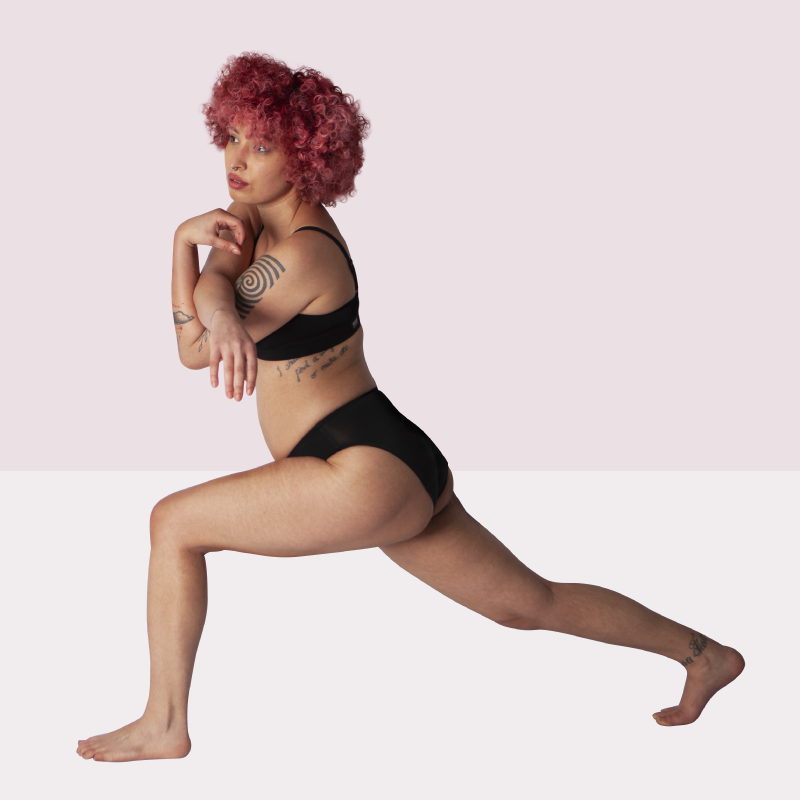 young woman performing yoga pose in wuka underwear