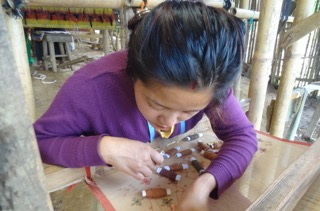 woman making dhaka fabric nepal 2