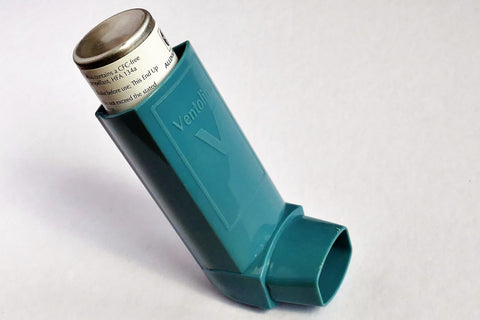 Teal inhaler with the cap off.