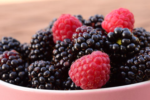 Bowl with raspberries and blackberries
