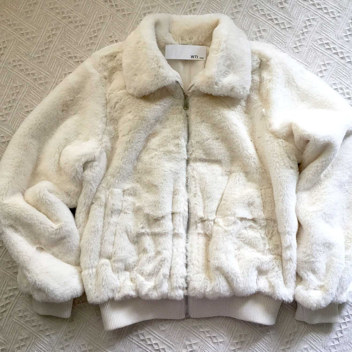 white fuzzy jacket