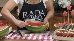Kristi decorating the edge of a large watermelon with the RADA Paring Knife