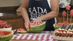 Kristi making even slices from a large watermelon using the RADA Slicer knife