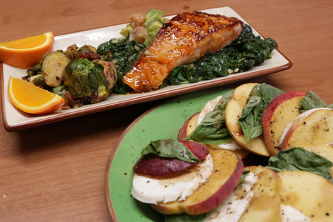 Summer Salmon with Apricot and Siracha Glaze and peach caprese salad in the bottom right corner