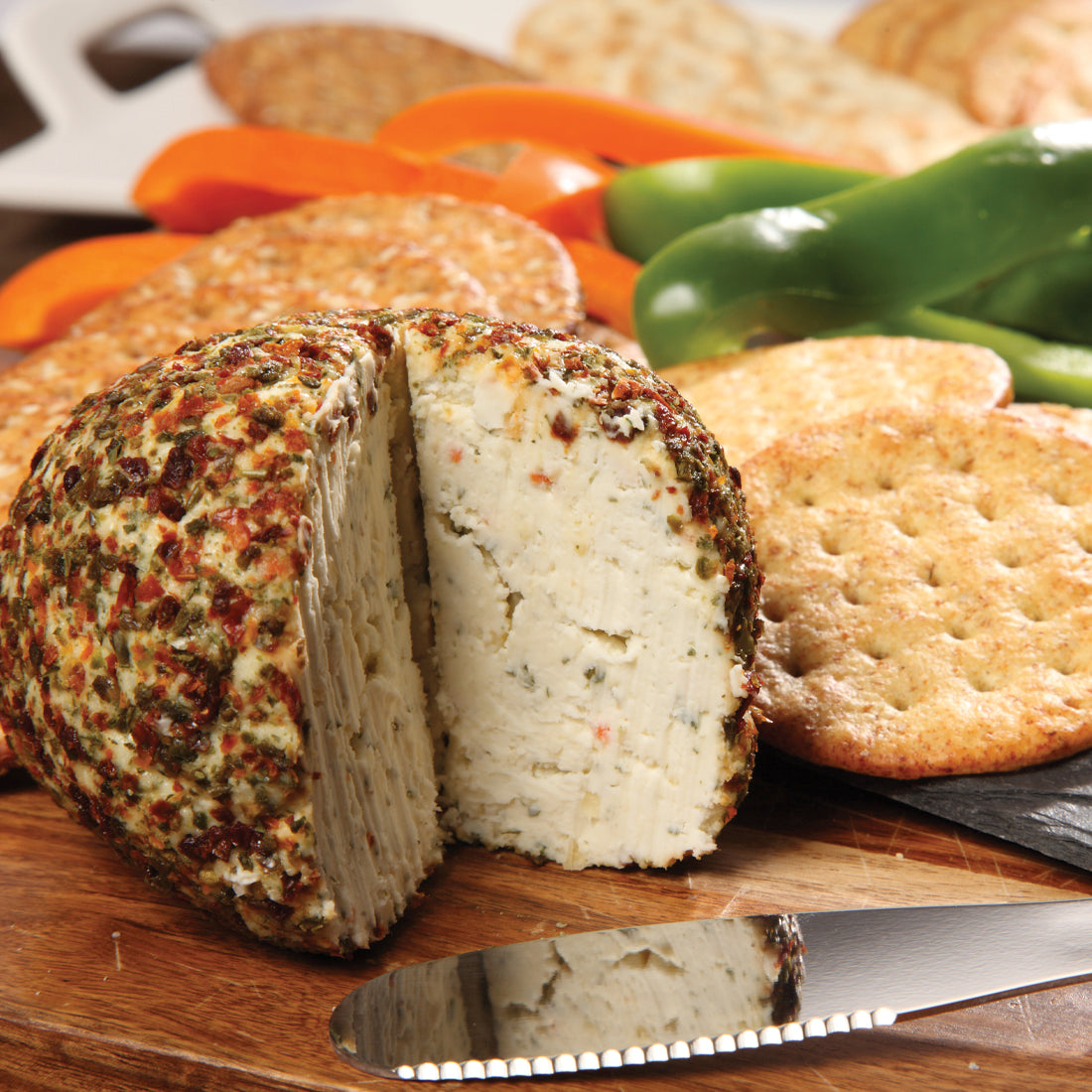 Garden Vegetable Cheeseball prepared with cream cheese served with crackers and veggies