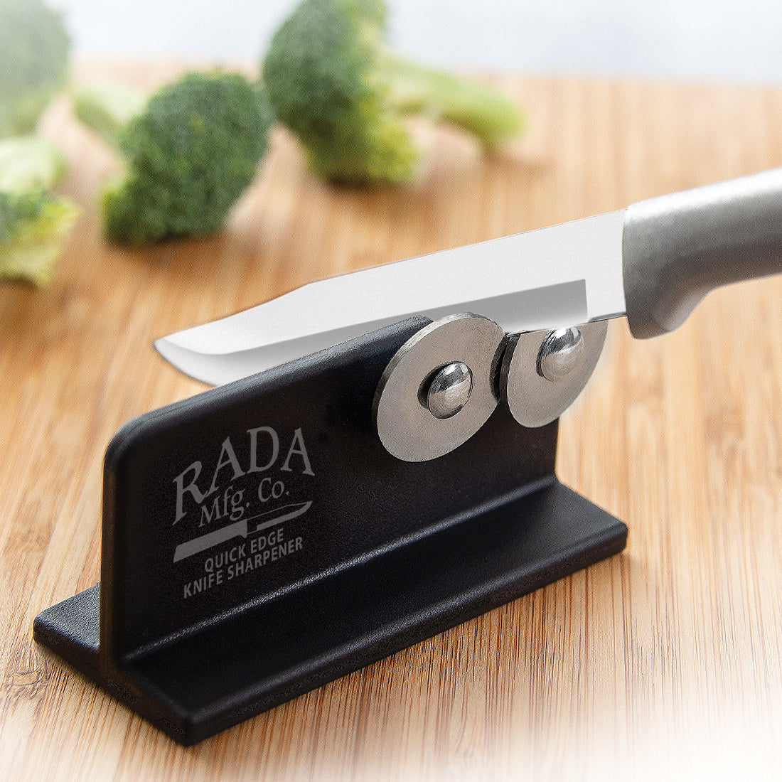 Rada Cutlery Knife Sharpener with logo on styled background.