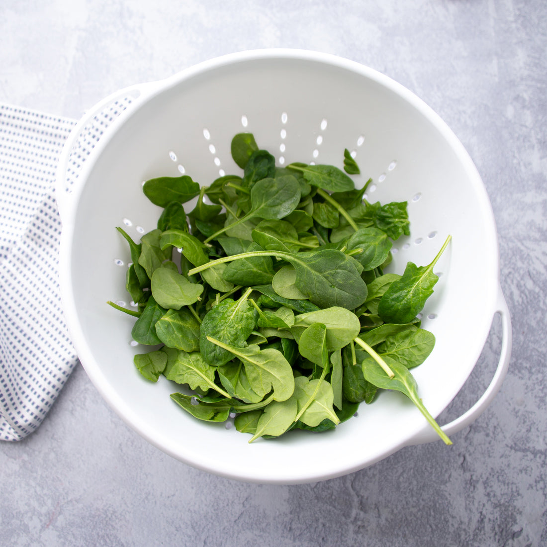 Rada Cutlery Large 5 Quart Colander with spinach.