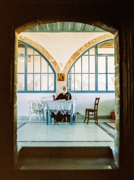 A monk sat in the middle of a christian monastery.